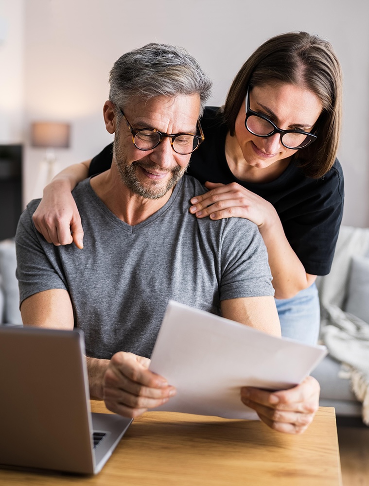 Couple Doing Taxes And Family Budget