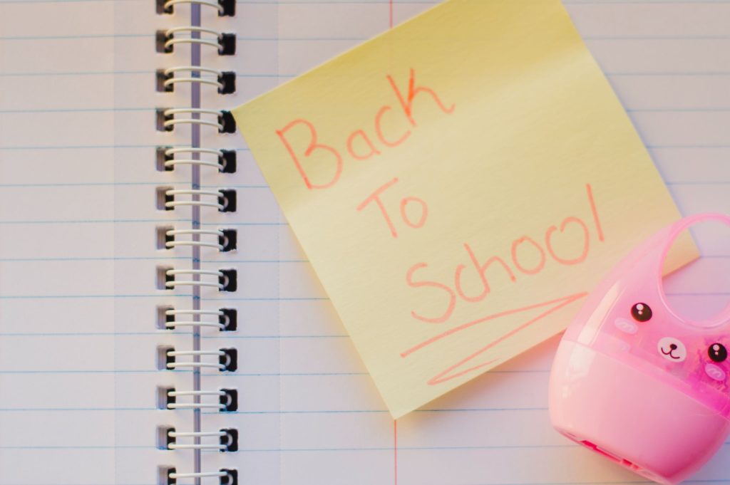 Sticky note with Back to School text on a notebook